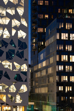 Night lights and pattern across facade of tower in Oslo Norway Barcode show architecture and windows in minimalist city frame tonight
