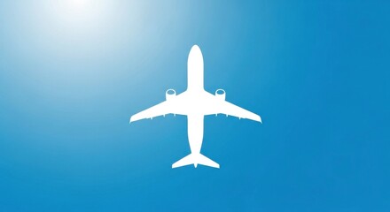 Fototapeta premium Plane's stark white silhouette contrasted against a bright blue gradient sky