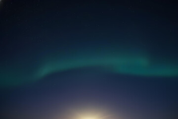 Naklejka premium Northern Lights Shine Across The Starry Deep Night Sky.