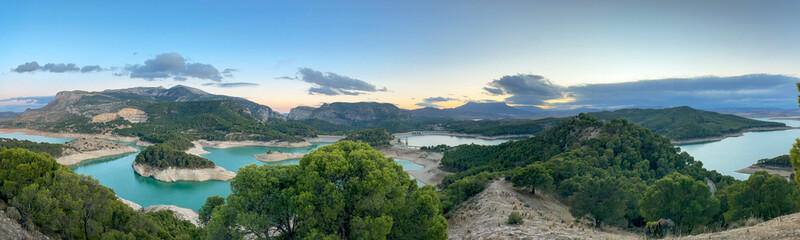 Obraz premium Landscape View of Guadalhorce Dam Affected by Water Shortage at Sunset, Andalusia, Spain