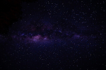 Obraz premium Nebula in a dark starry night sky