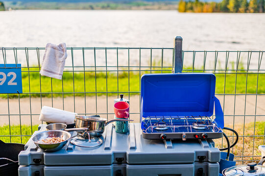 a small kitchen set up on a camping ground