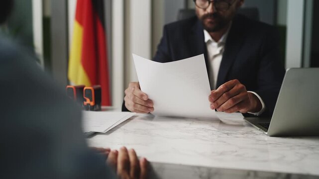 German customs officer denying citizenship application and stamping document