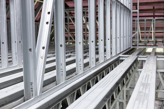 Medium shot of interior steel stud framing showcasing lightweight precise metal framework for modern wall construction