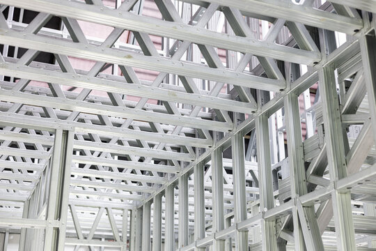 Medium shot of interior steel stud framing showcasing lightweight precise metal framework for modern wall construction