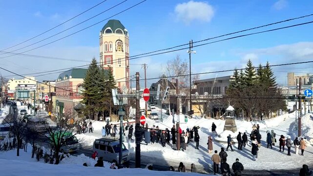 Time lapse of Sakaimachi street retail market in a preserved merchant street is tourist attraction during winter , Hokkaido, Japan