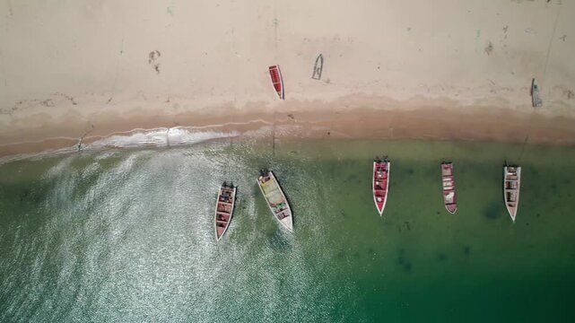 Aerial view of boats on Punta Araya's sandy beach with calm waves