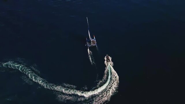 Boat Makes Turn. Aerial Perspective Captures Boat Executing Sharp And Precise Turning Maneuver