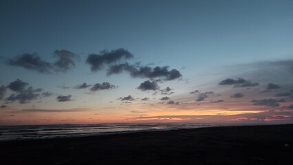 sunrise over the mountains on sunset on the beach