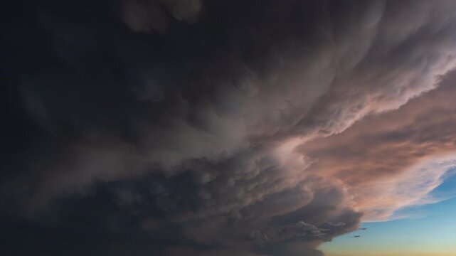 Dramatic cloudy sky with thunderclouds and deep shadows adding atmospheric weather texture