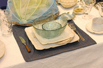 Glass Bowls Ceramic Plates at Denim Cloth Summer Dining Table Setup Angle View
