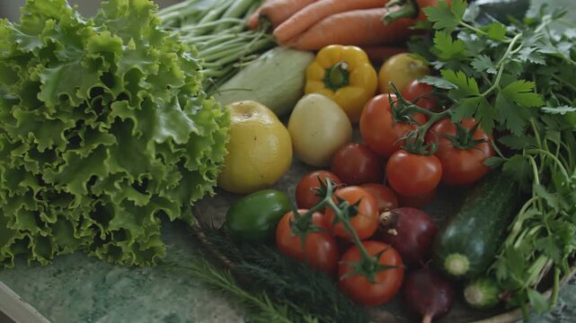 Freshly harvested garden vegetables arranged beautifully on a rustic surface, showcasing vibrant colors.