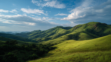 Obraz premium A serene landscape of rolling green hills under a blue sky