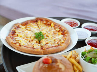 Pizza and hamburgers on the table