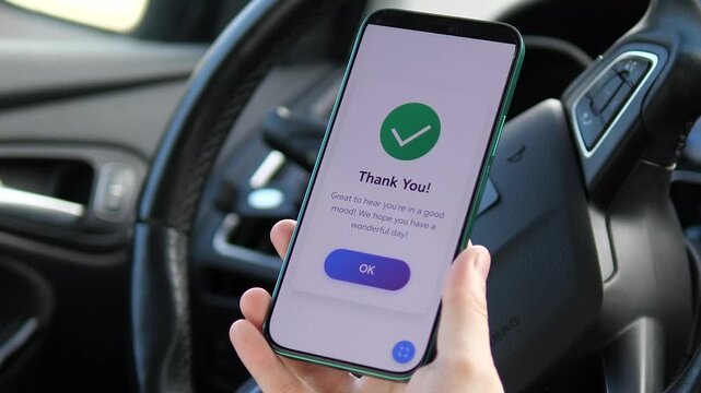 Tracking happiness on the go: close-up of a hand using a mental wellness app. Choosing Good Mood with a success message. Perfect for mobile app marketing, healthcare tech, and modern lifestyle themes