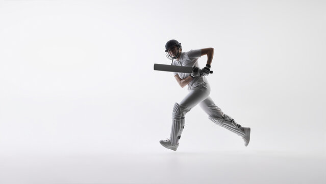 Female cricket player in dynamic jump and run motion. Concept of athletic activity, sports performance marketing, physical power, and modern representation in professional sports campaigns.