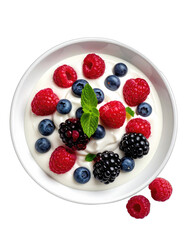A white bowl filled with creamy yogurt topped with fresh raspberries, blueberries, and blackberries, garnished with mint, set against a stark black background.