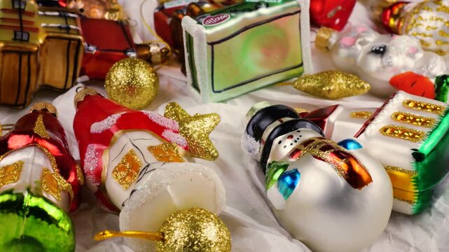 Festive holiday travel decorations on white background. Vintage-style Christmas ornaments featuring city names like Paris and Chicago. Charming seasonal display perfect for travel or holiday themes.