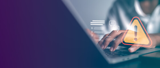Professional man typing on laptop with AI system error and warning triangle icon interface. Concept...