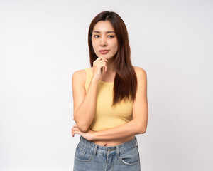 Beautiful young asian woman in yellow shirt. Charming female lady standing pose thinking on...