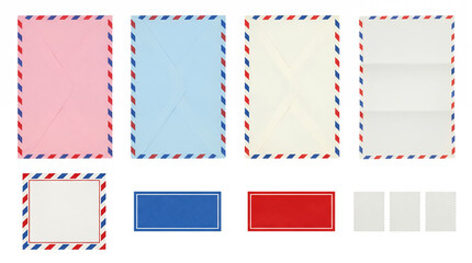 Airmail stationery set including colored envelopes, folded paper, adhesive labels, and postage stamps isolated. Vintage postal and mailing collection.