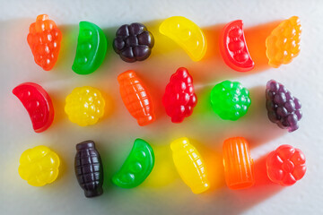 Brightly Colored Sour Gummy Candy on a White Background