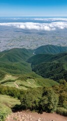 Obraz premium View of green mountains, city in the distance, and rain clouds above, showcasing nature and the high altitude near Jodo Shrine