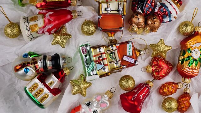 Festive holiday travel decorations on white background. Vintage-style Christmas ornaments featuring city names like Boston, New York, Paris, Chicago and Los Angeles. 