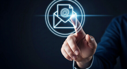 Fototapeta premium A businessman interacting with a glowing email icon on a dark background