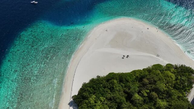 Aerial drone view of Ukulhas island Maldives surrounded by turquoise lagoon and white sand