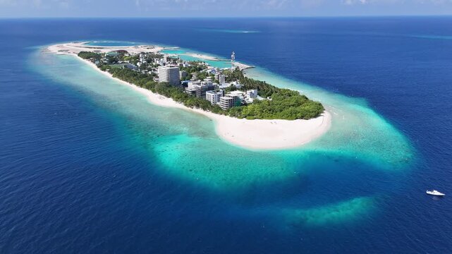 Aerial drone view of Ukulhas island Maldives surrounded by turquoise lagoon and white sand