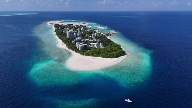 Aerial drone view of Ukulhas island Maldives surrounded by turquoise lagoon and white sand