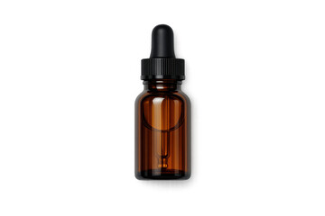 Naklejka premium Amber glass dropper bottle with black cap and clear liquid inside, isolated on black background