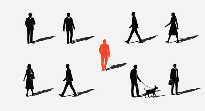 Individuality concept with one red person standing out from crowd of black silhouettes walking in same direction