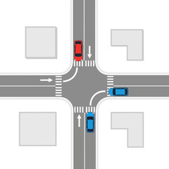 Top view of a busy traffic intersection with cars navigating crossroads and pedestrian crossings.
