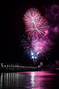 Purple Fireworks exploding Over The Ferry Building at night, San Francisco, California, USA