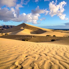 Majestic Sand Dunes Under a Blue Sky in Fuerteventura, Canary Islands.