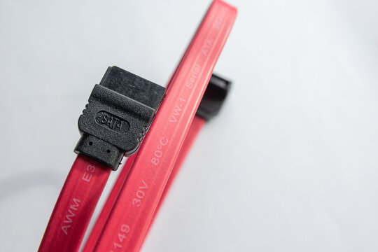 Red sata data cable connecting computer hardware components