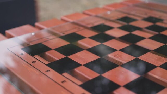 Chess board markings reveal precise geometric pattern closeup . Surface reflects strategic clarity order and classic game aesthetics