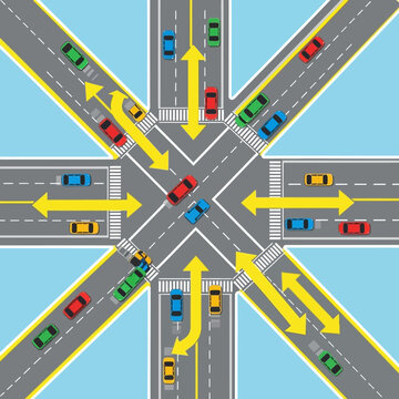 Busy Traffic Intersection with Cars and Yellow Arrows - Aerial View