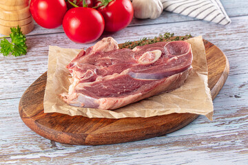 Raw lamb steak with bone