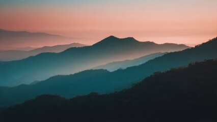 Obraz premium Mountain range at dusk with pink sky