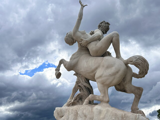 Beautiful and imposing sculpture "The centaur Nessus abducting Deianira" in the Tuileries Garden, Paris, France. Sculpture depicts a scene from Greek mythology.