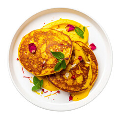 Indian pancakes with saffron & rosewater cream (malpua & rabri), top view on white plate. Indian dish on the plate for menu, cafe, design