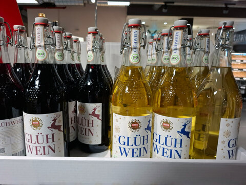 FRANKFURT AM MAIN, GERMANY - October 31, 2025.Bottles of REWE Bio Gluhwein on supermarket shelves in Germany during winter holiday season