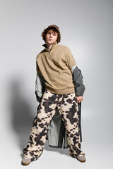 Stylish teenager showcasing unique fashion choices during an urban photoshoot