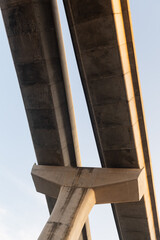 Low angle view of concrete elevated expressway structure against sky