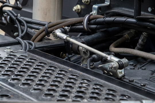 Semi-trailer, truck spare parts. Tubes, various fasteners and auto electronics. View on truck chassis frame equipment. Truck back parts details devices. Truck MOT maintenance repair.