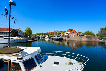 Scenic waterfront view of the historic harbor and traditional houses in Brielle, South Holland, the Netherlands © Alexandre ROSA
