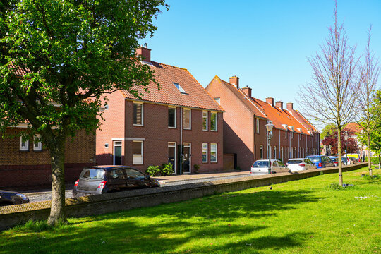 Modern red brick terraced houses in a quiet residential area of Brielle, South Holland, the Netherlands